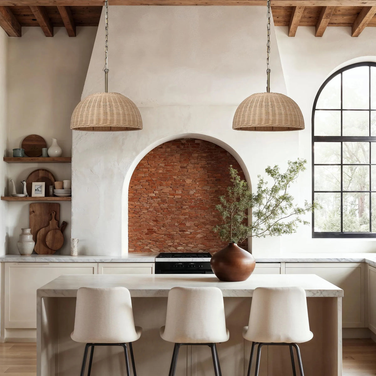 rattan pendants hanging over a kitchen island