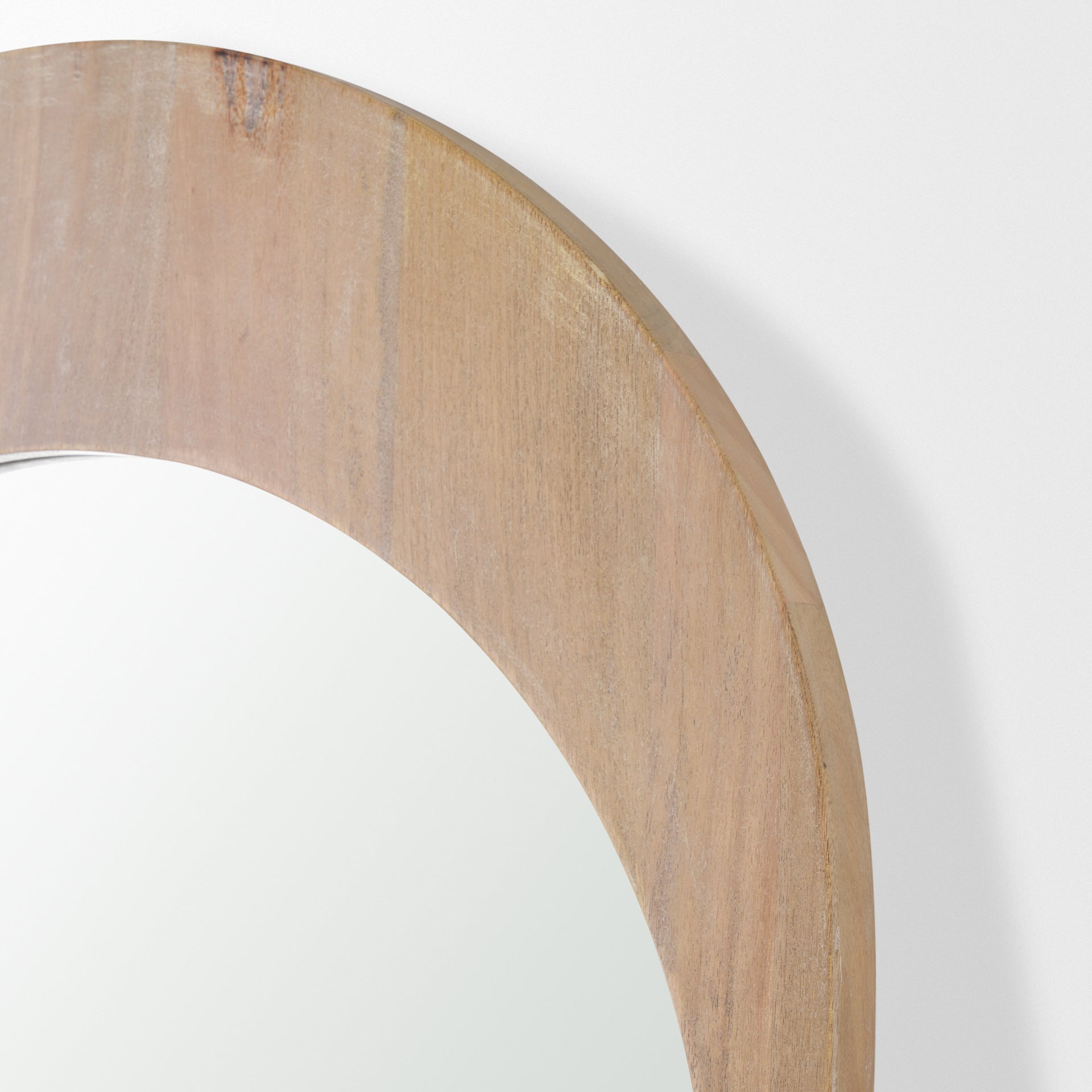 The full length Arched Celeste Mirror with solid mango wood frame has a smooth light brown finish.