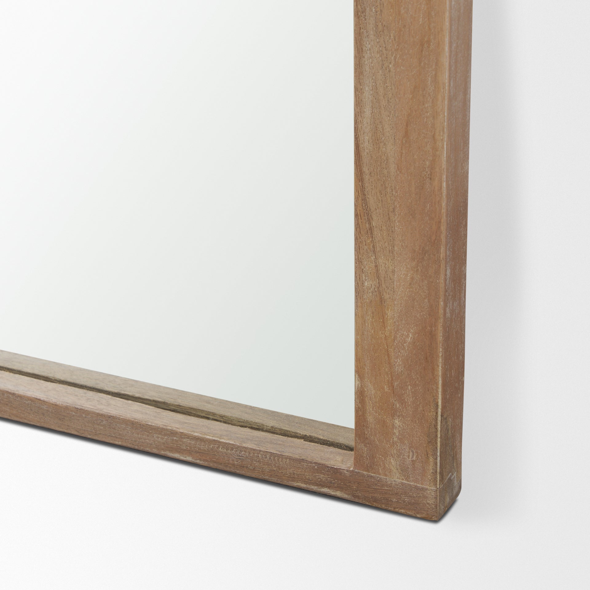 The full length Arched Celeste Mirror with solid mango wood frame has a smooth light brown finish.