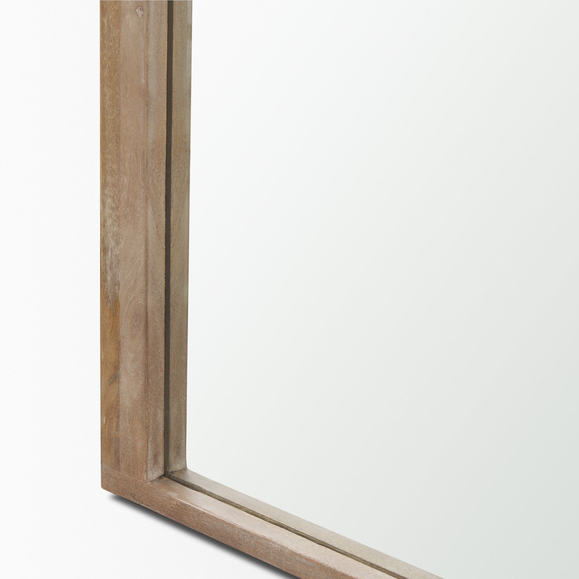 The full length Arched Celeste Mirror with solid mango wood frame has a smooth light brown finish.