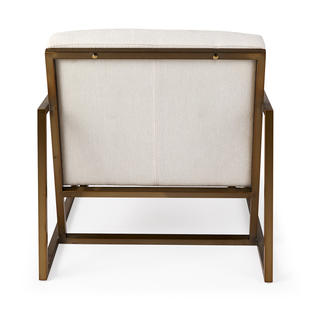 A metal and fabric accent chair oozing angular elegance.  Gold metal frame and cream fabric.