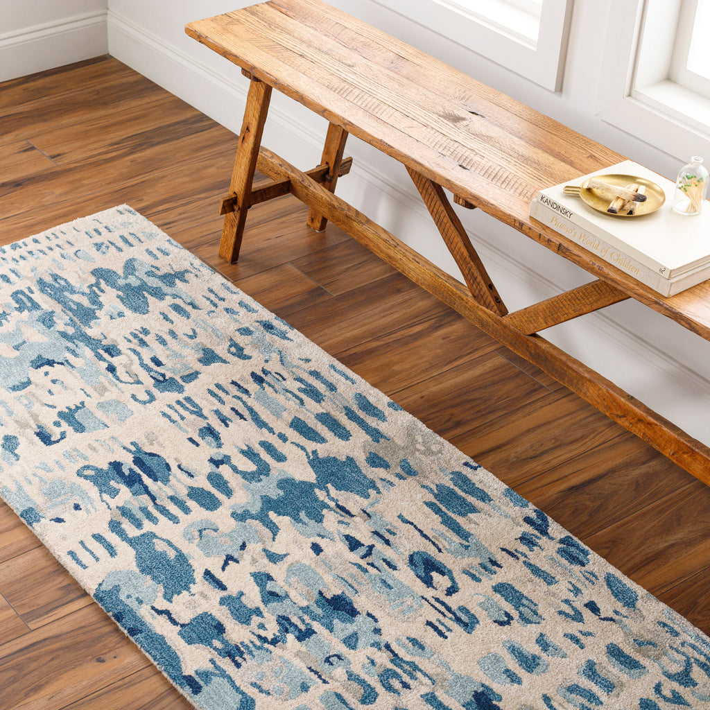 the kavita area rug, a wool and viscose blend, in a abstract pattern including colours Navy, Denim, Gray, Light Gray, Light Beige