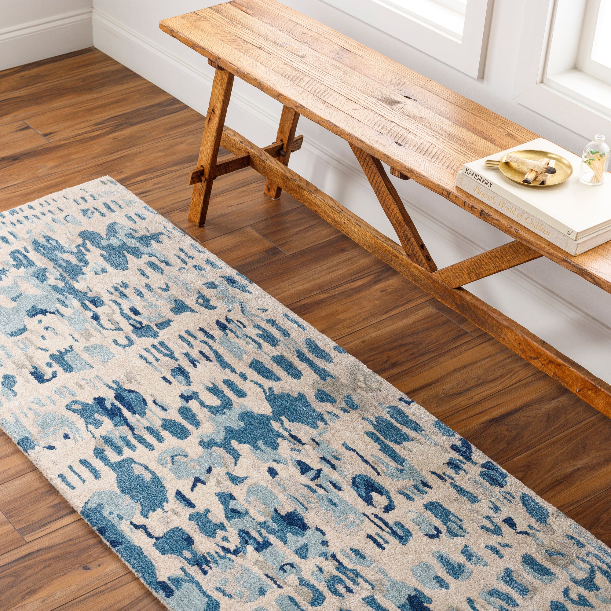 the kavita area rug, a wool and viscose blend, in a abstract pattern including colours Navy, Denim, Gray, Light Gray, Light Beige