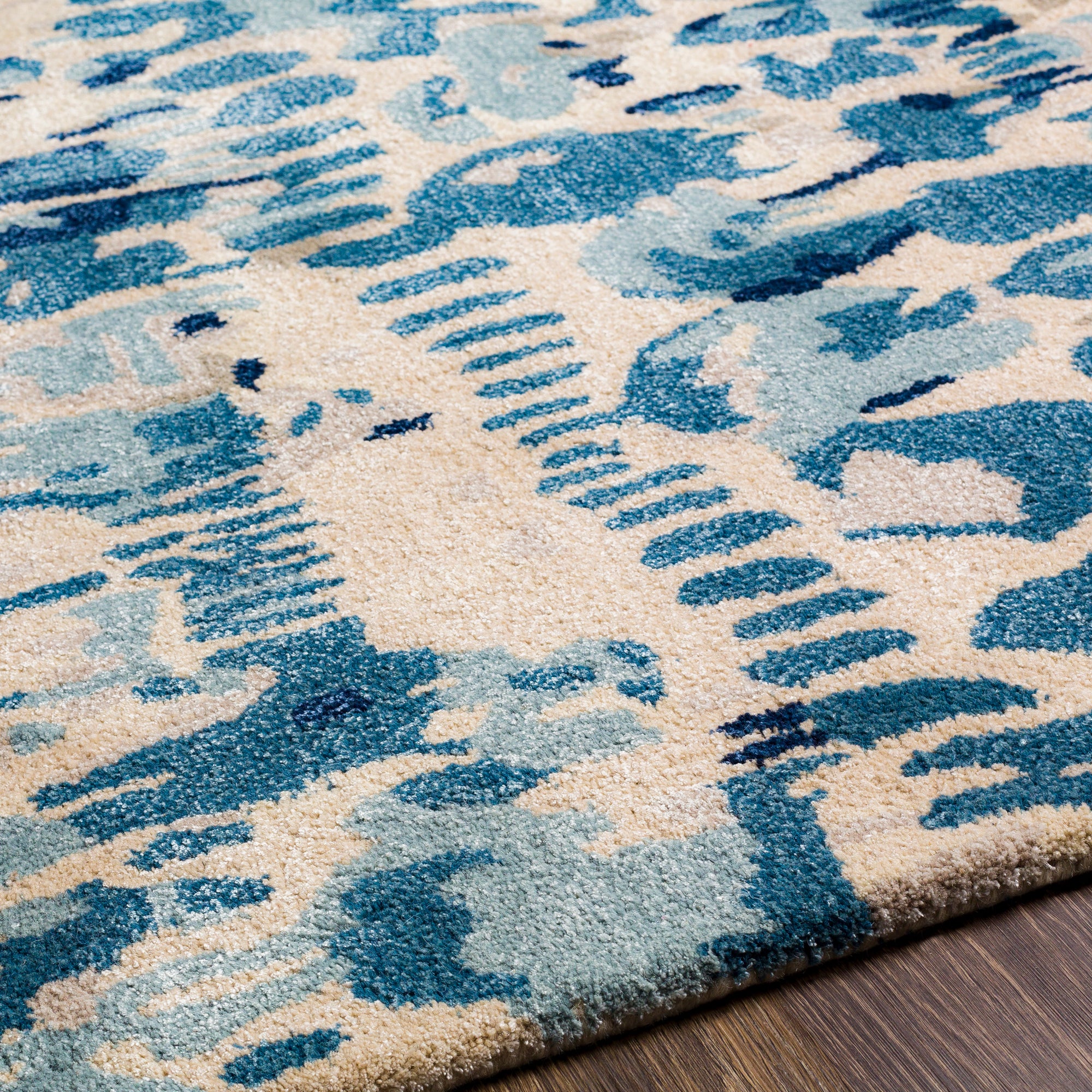 the kavita area rug, a wool and viscose blend, in a abstract pattern including colours Navy, Denim, Gray, Light Gray, Light Beige