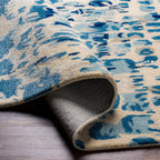 the kavita area rug, a wool and viscose blend, in a abstract pattern including colours Navy, Denim, Gray, Light Gray, Light Beige