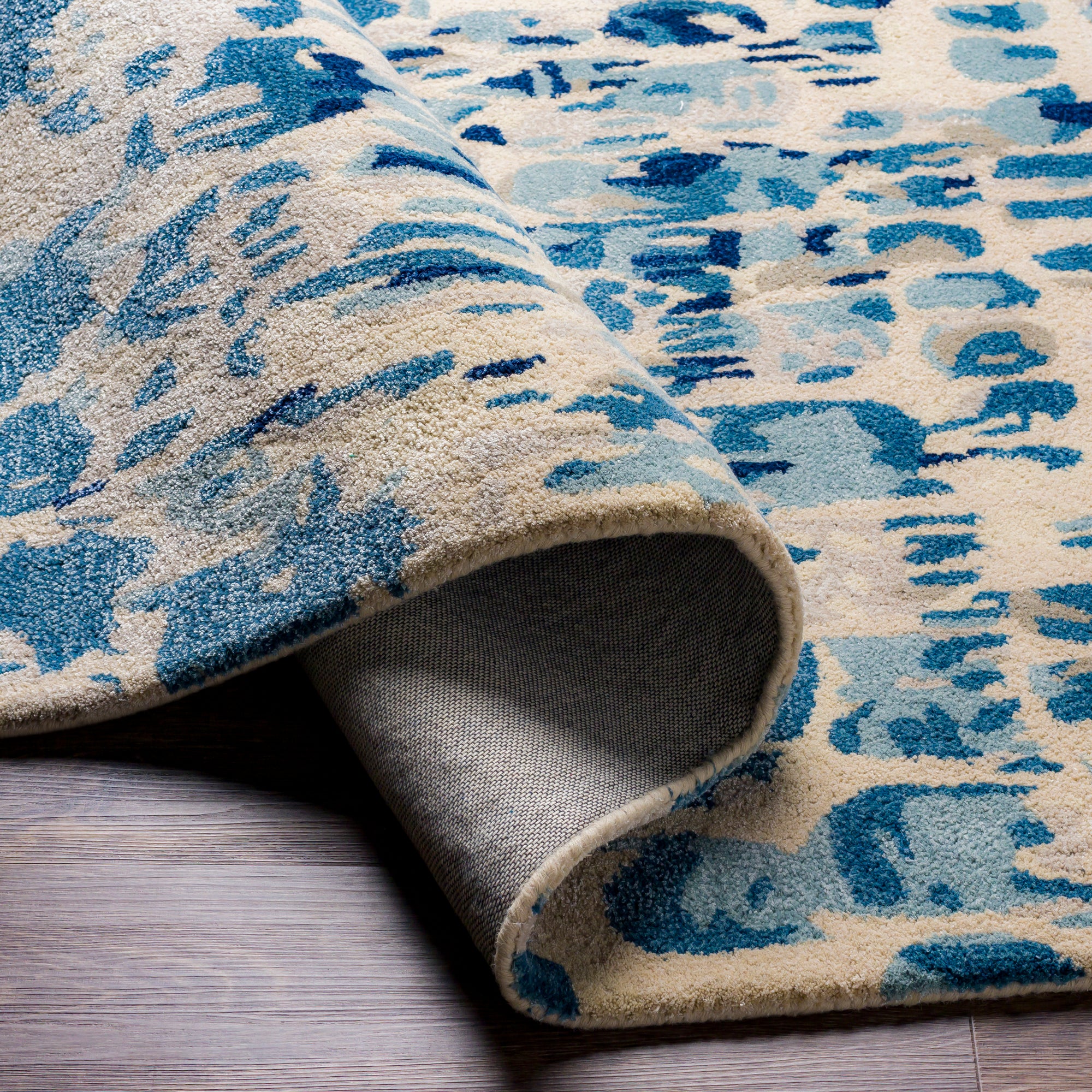 the kavita area rug, a wool and viscose blend, in a abstract pattern including colours Navy, Denim, Gray, Light Gray, Light Beige