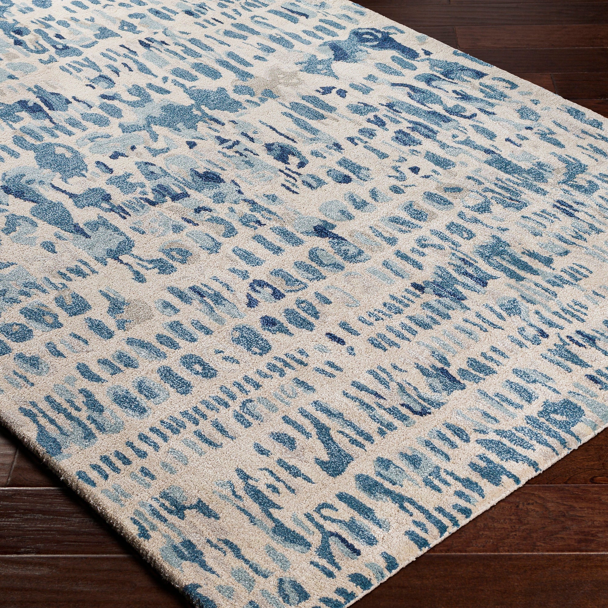 the kavita area rug, a wool and viscose blend, in a abstract pattern including colours Navy, Denim, Gray, Light Gray, Light Beige