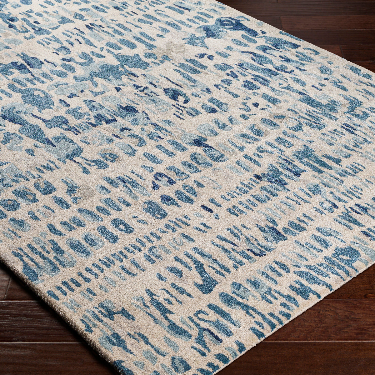 the kavita area rug, a wool and viscose blend, in a abstract pattern including colours Navy, Denim, Gray, Light Gray, Light Beige