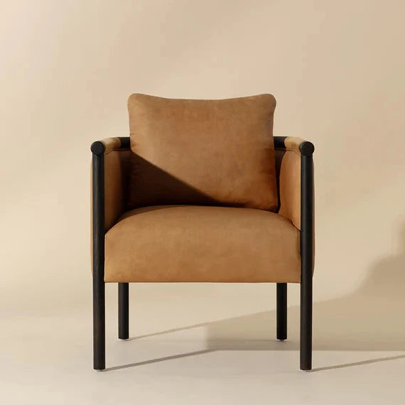 Brown armchair with black frame on a beige background