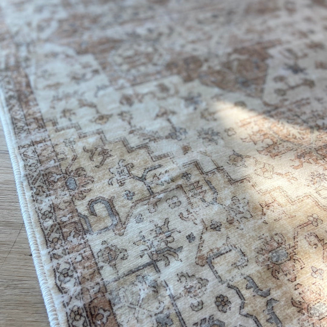 Close-up of a patterned rug on a wooden floor